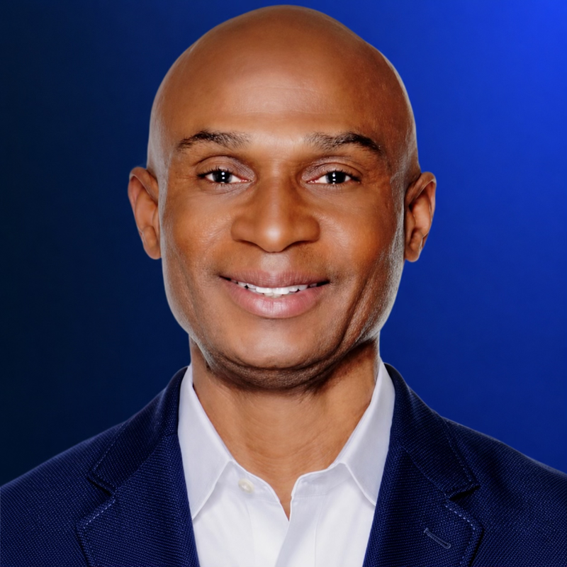 Headshot of Dr. Michael W. Craige wearing a navy blazer and white shirt